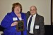 Dr. Nagib Callaos, General Chair, giving Dr. Tina M. Serafini a plaque "In Appreciation for Delivering a Great Keynote Address at a Plenary Session."